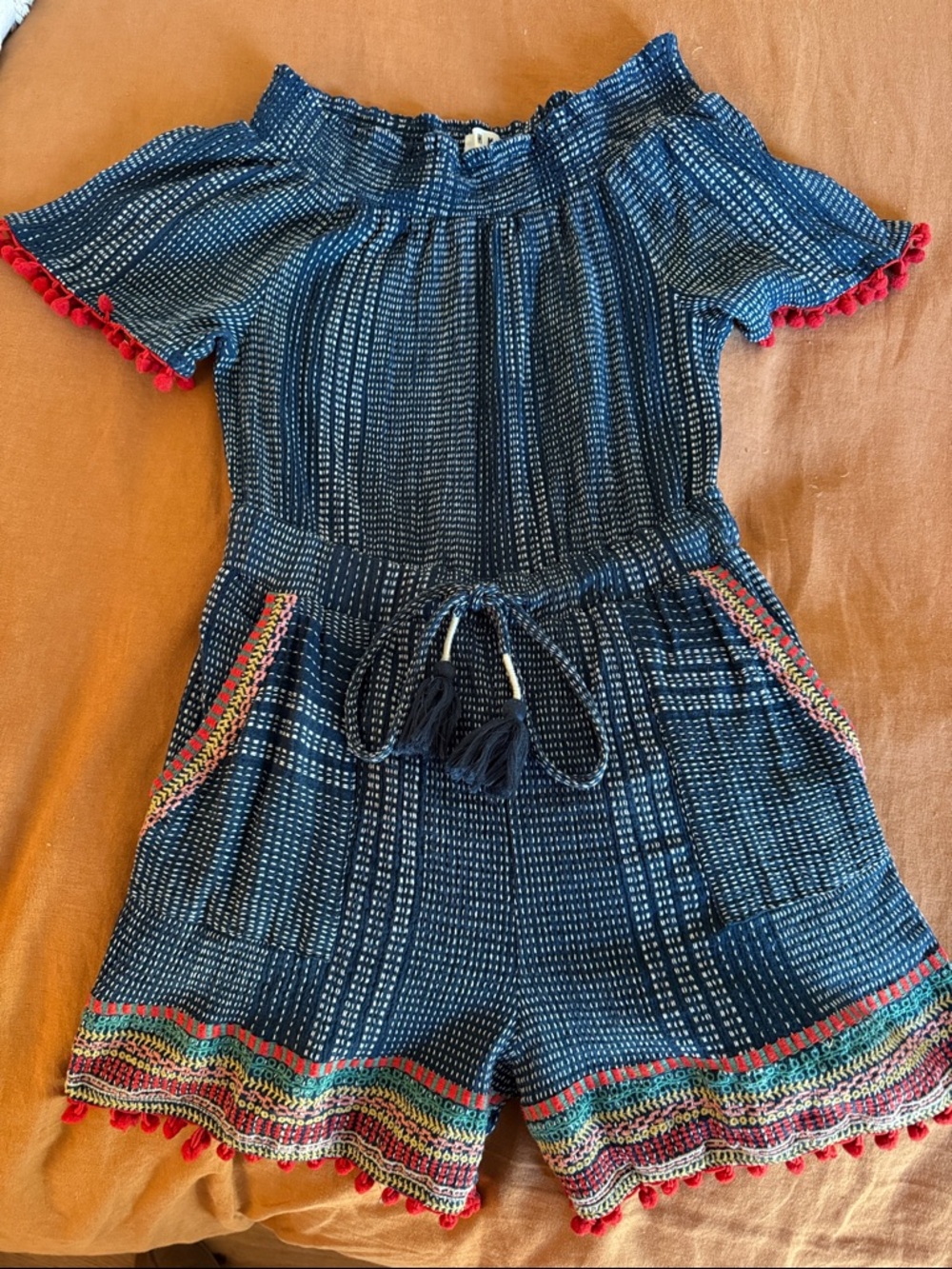 Flirty Off-Shoulder Navy Blue Romper with Red Pom Pom Trim